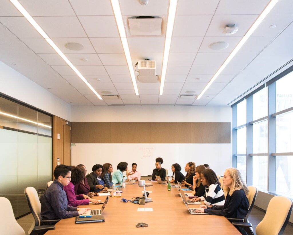 Corporate team in a boardroom working through a training session